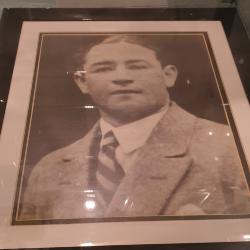 Framed portrait photograph of a young man in a suit