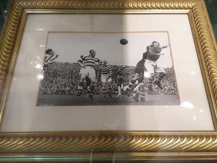Framed match action photograph, Shamrock Rovers before a large crowd