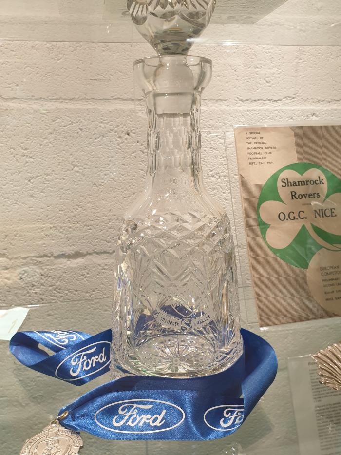 RDS glass bottle and medal, 1990